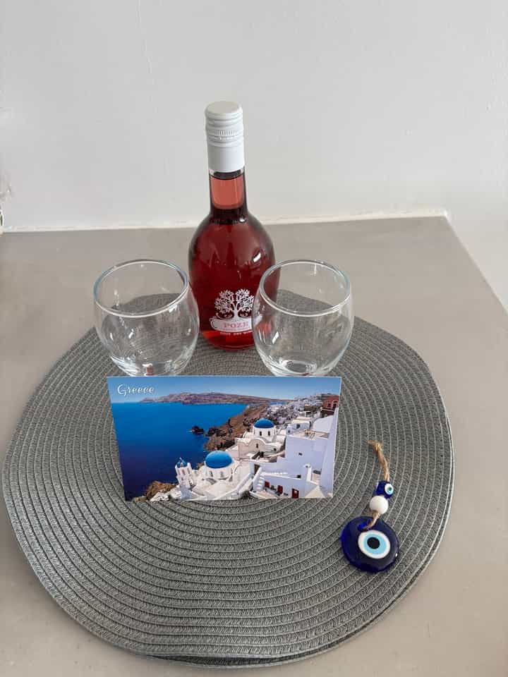 Our host had left a bottle of dry rose wine, a nice card, and an evil-eye charm to greet us.
