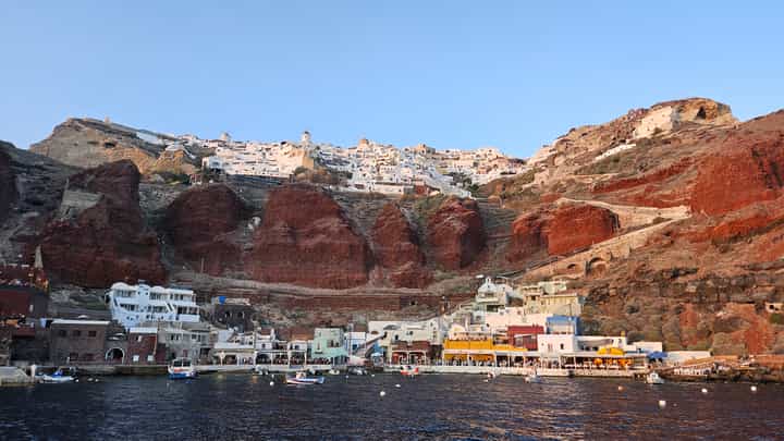 The city of Oia, and port below.