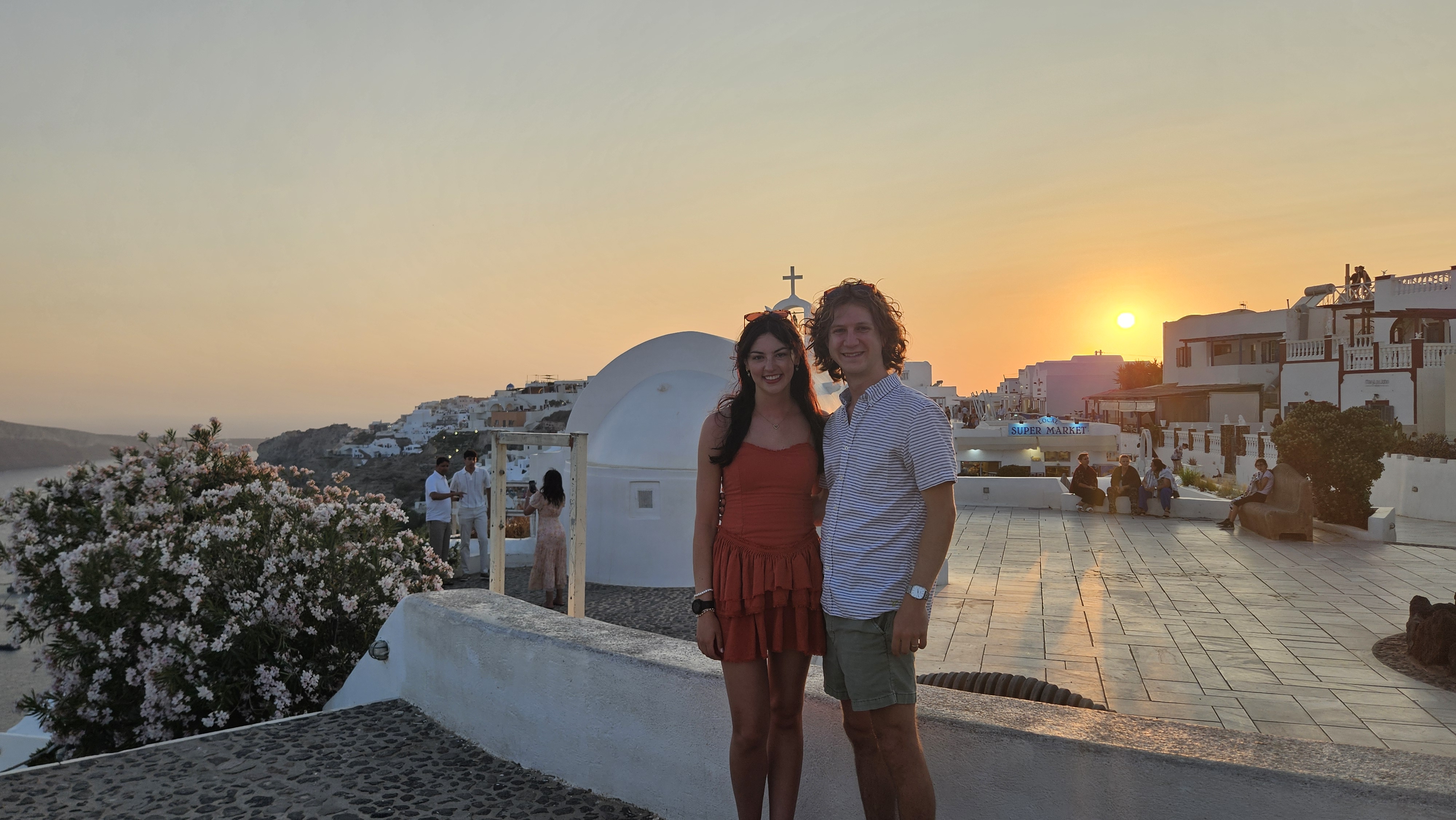 Enjoying the end of the sunset in Oia before eating.