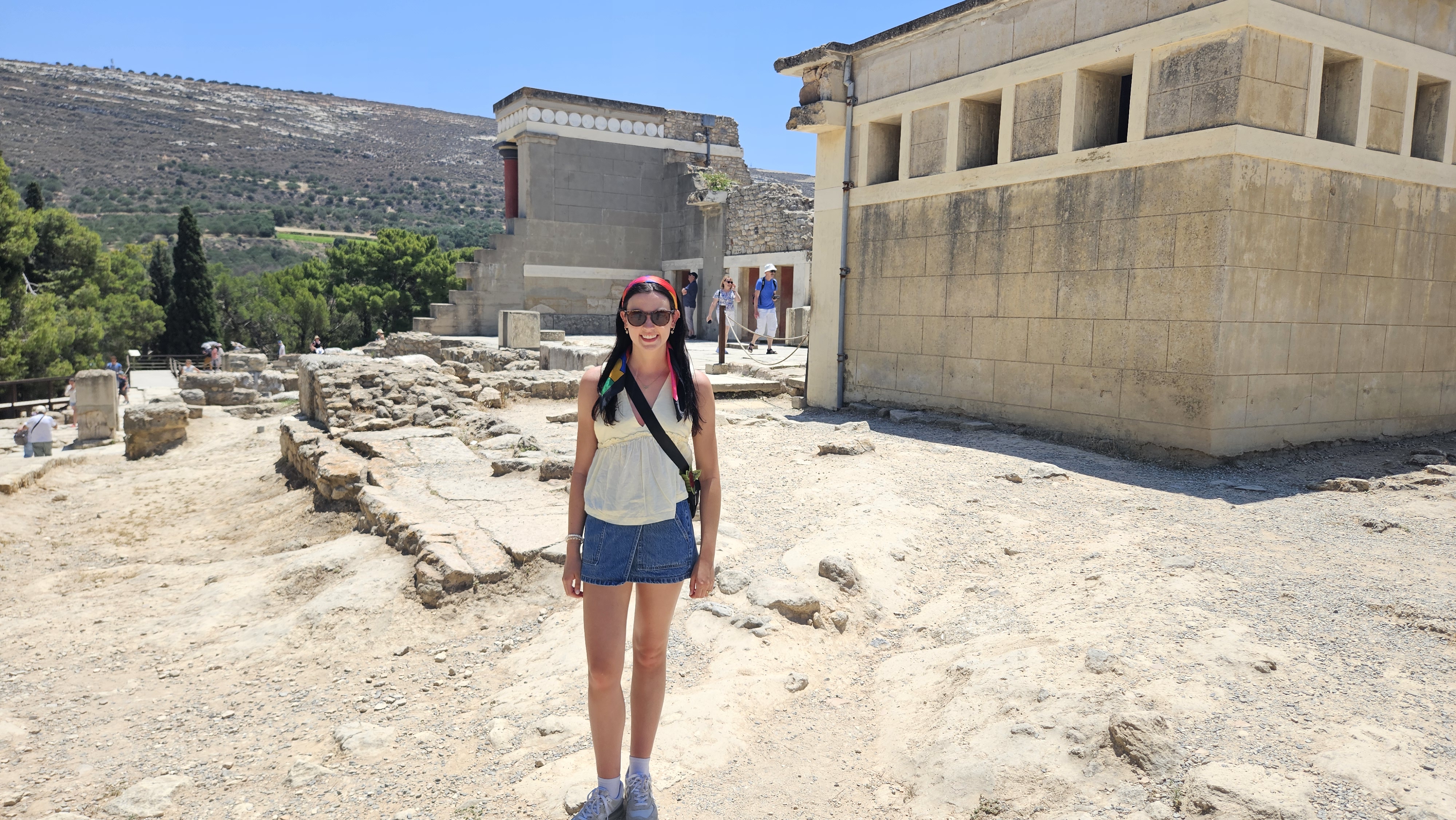 Hannah at Knossos. Note the reconstructed rooms in the background